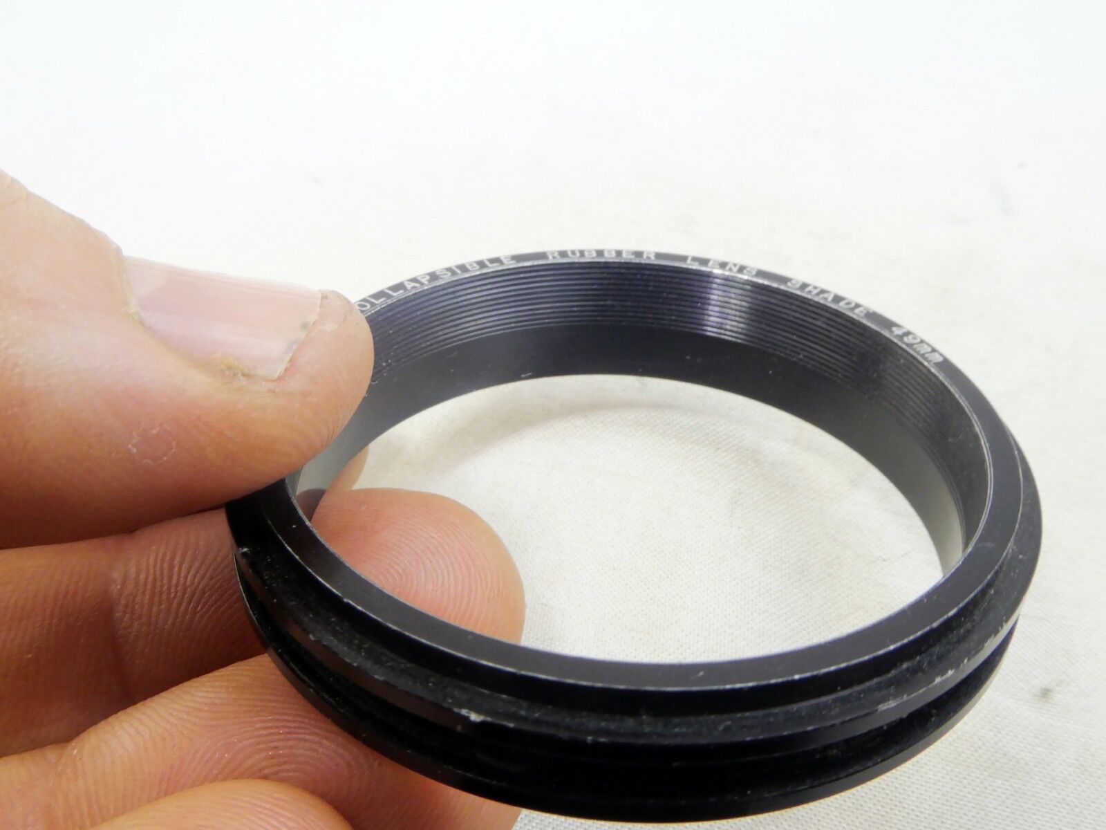 Metal ring from 49mm lens rubber hood (only metal part)