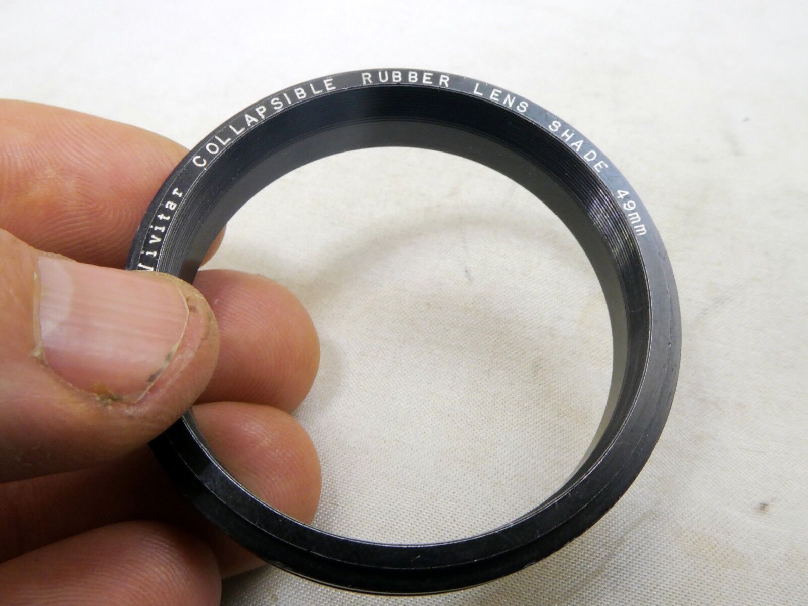 Metal ring from 49mm lens rubber hood (only metal part)