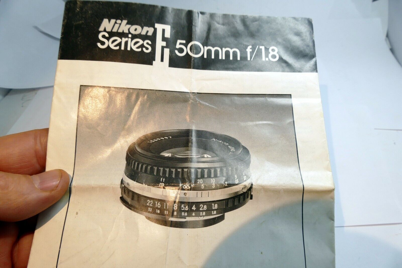 Nikon E series 50mm f1.8 Ai-s Lens instruction manual  EN German French Spanish