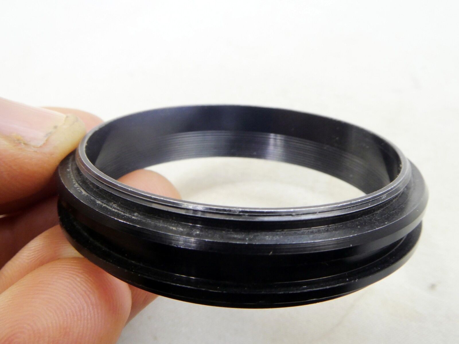 Metal ring from 49mm lens rubber hood (only metal part)