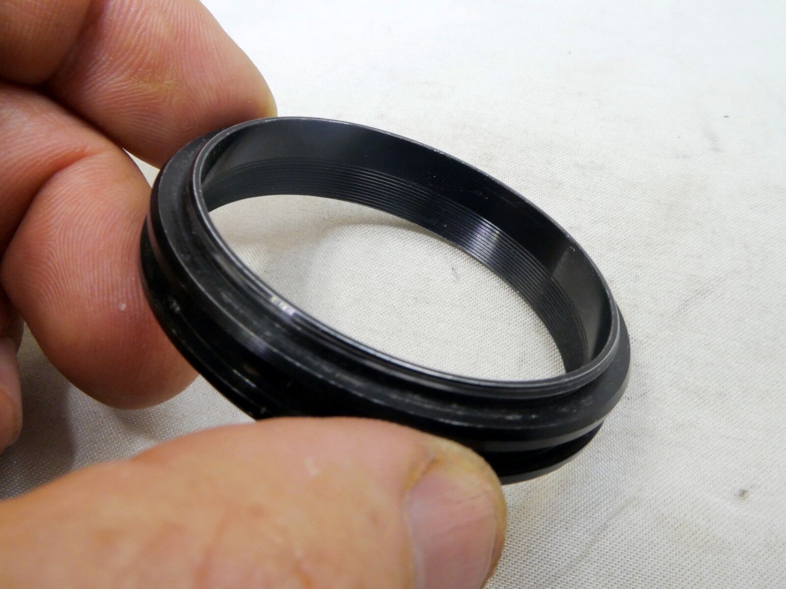 Metal ring from 49mm lens rubber hood (only metal part)