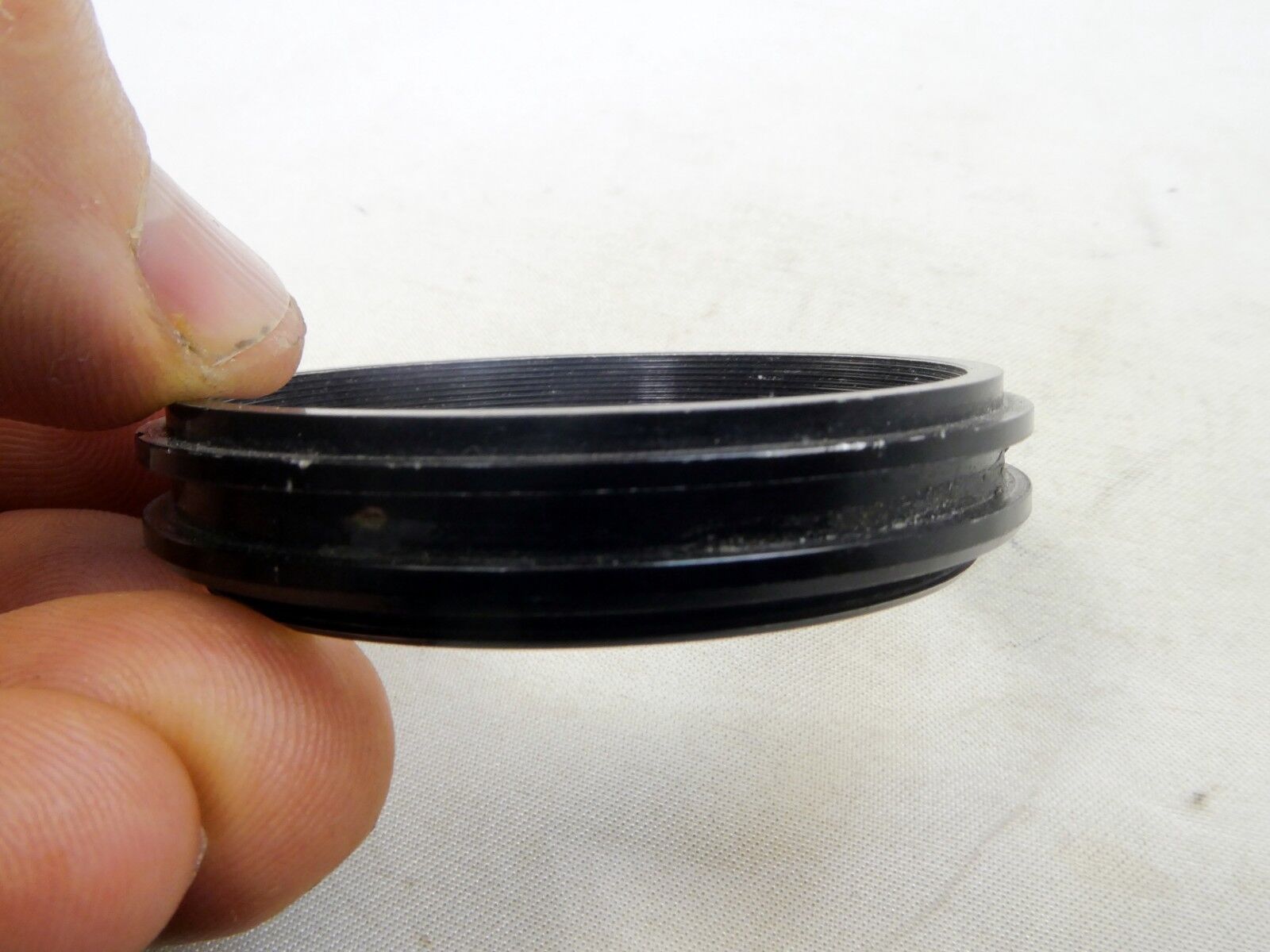 Metal ring from 49mm lens rubber hood (only metal part)