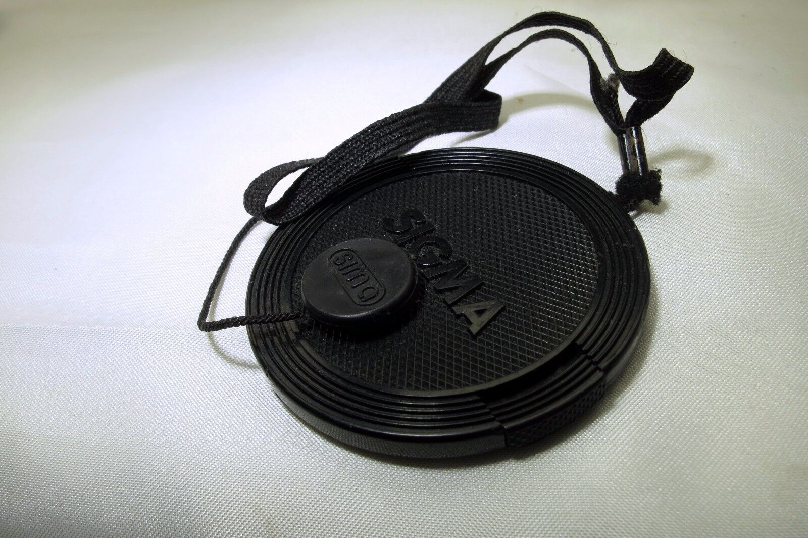 Sigma 55mm Front Cap dust cover with keeper string