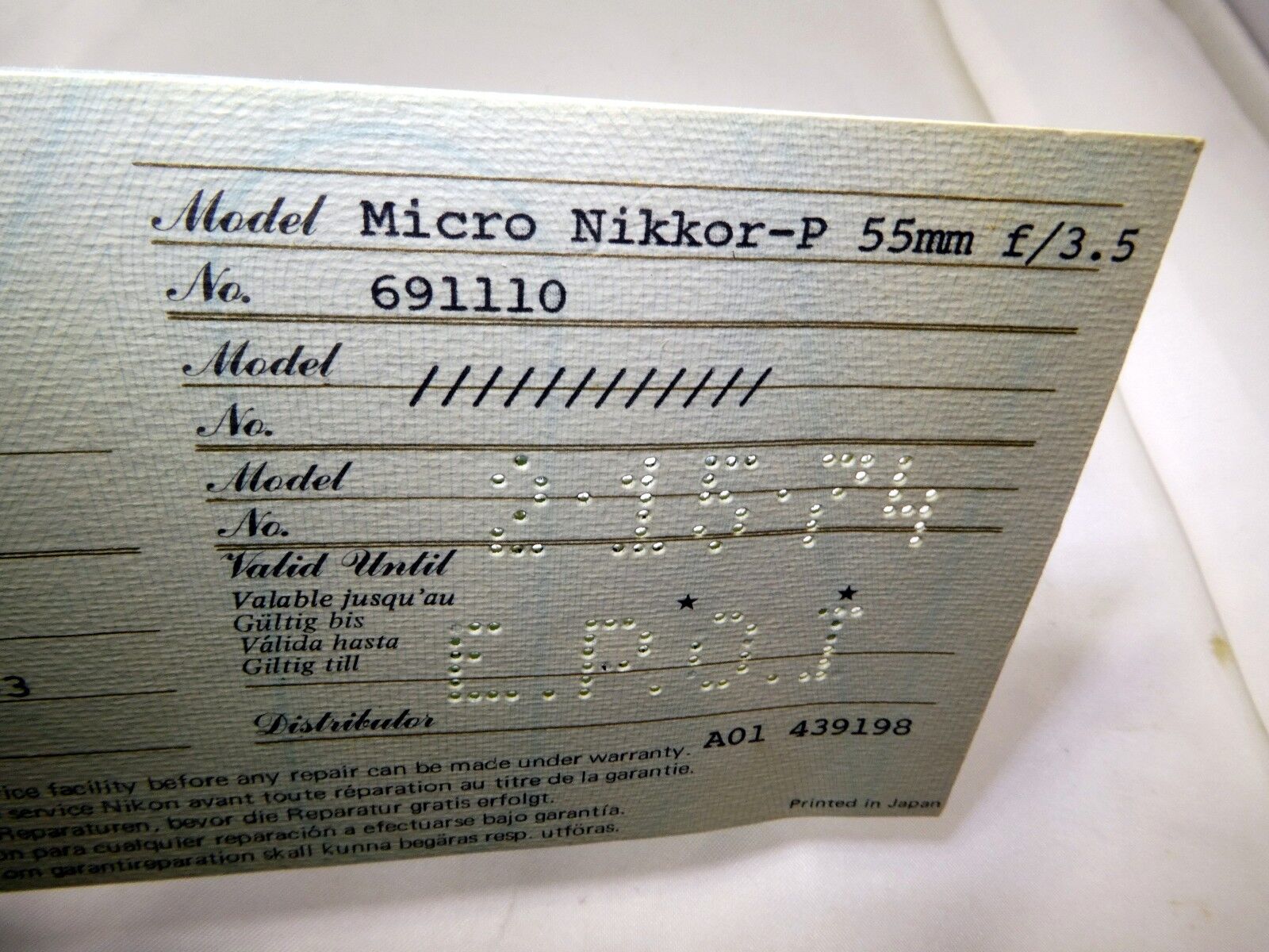 Nikon Worldwide Service Warranty card (EN) vintage micro Nikkor-P 55mm f3.5 1974