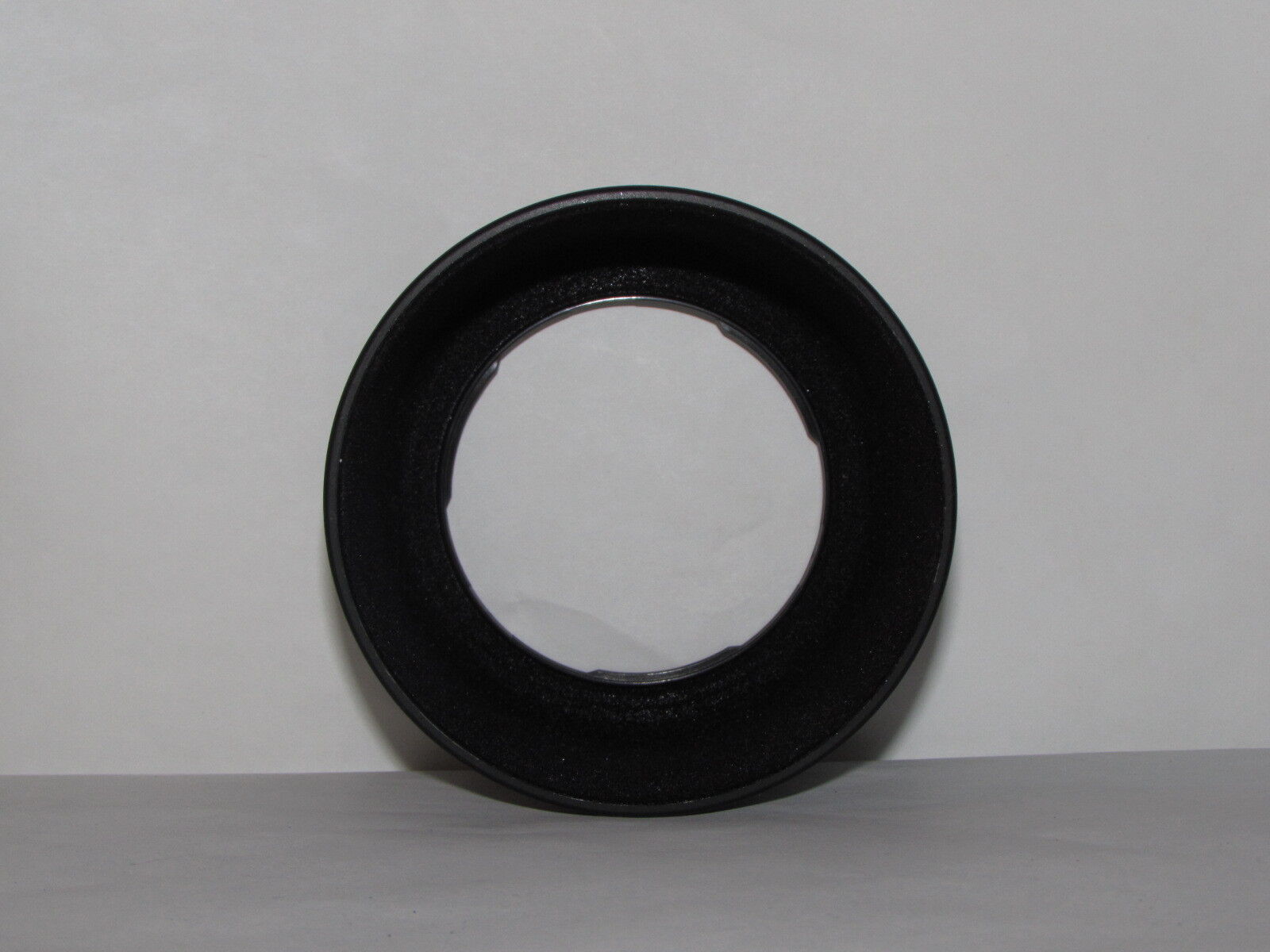 Used 57.5mm ID Twist on Lens Hood unknown brand or model