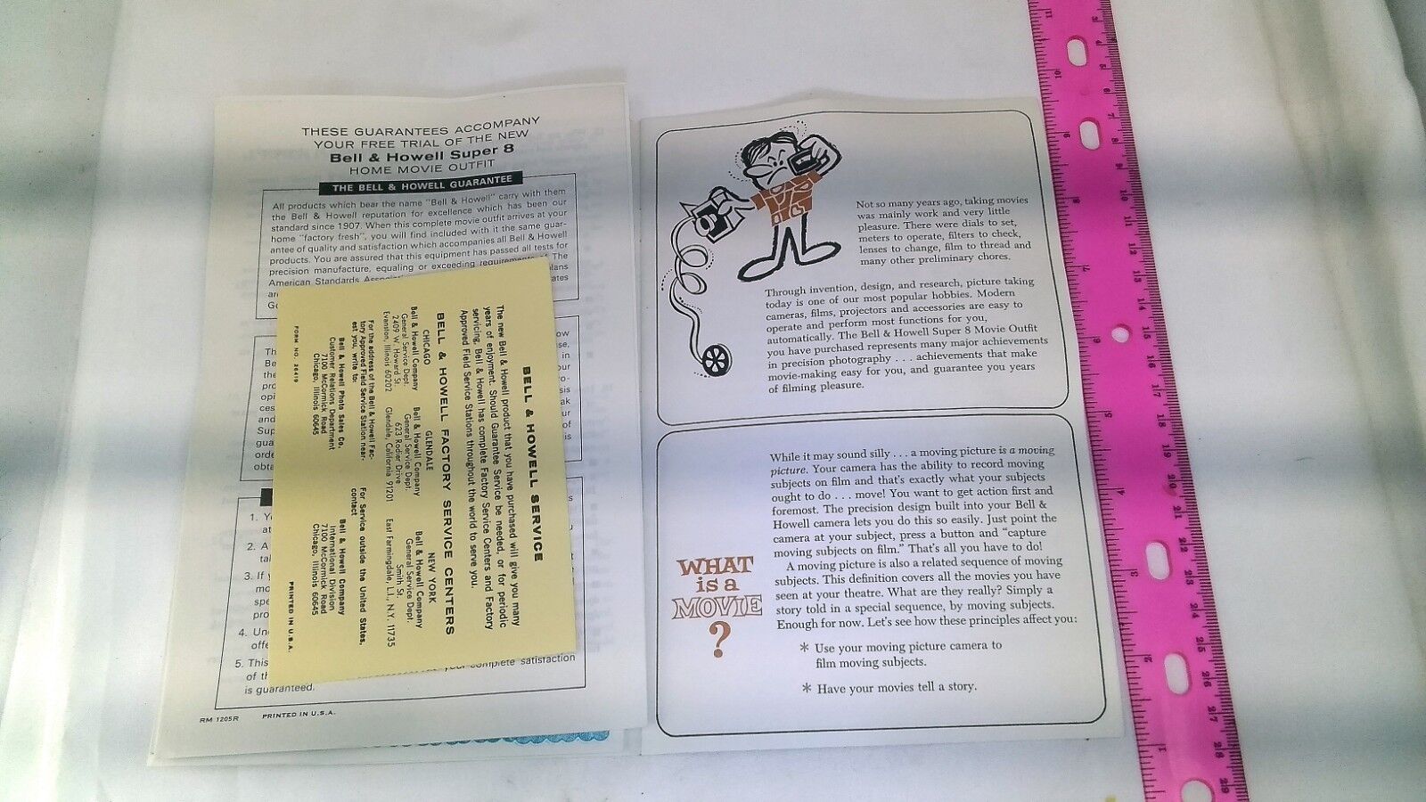 Bell & Howell Super 8 Camera Guide Book English composition background angles