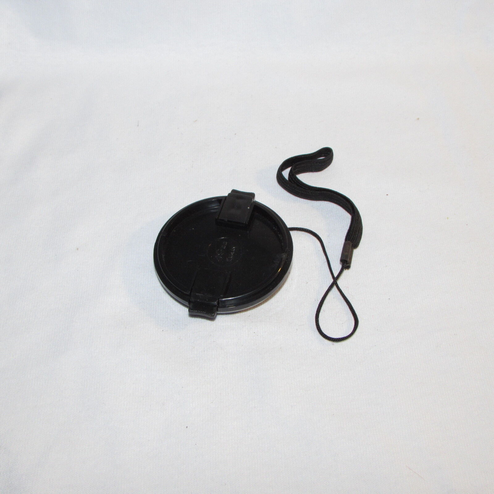 Used 49mm Lens Front Cap Made in Taiwan with keeper string B01555