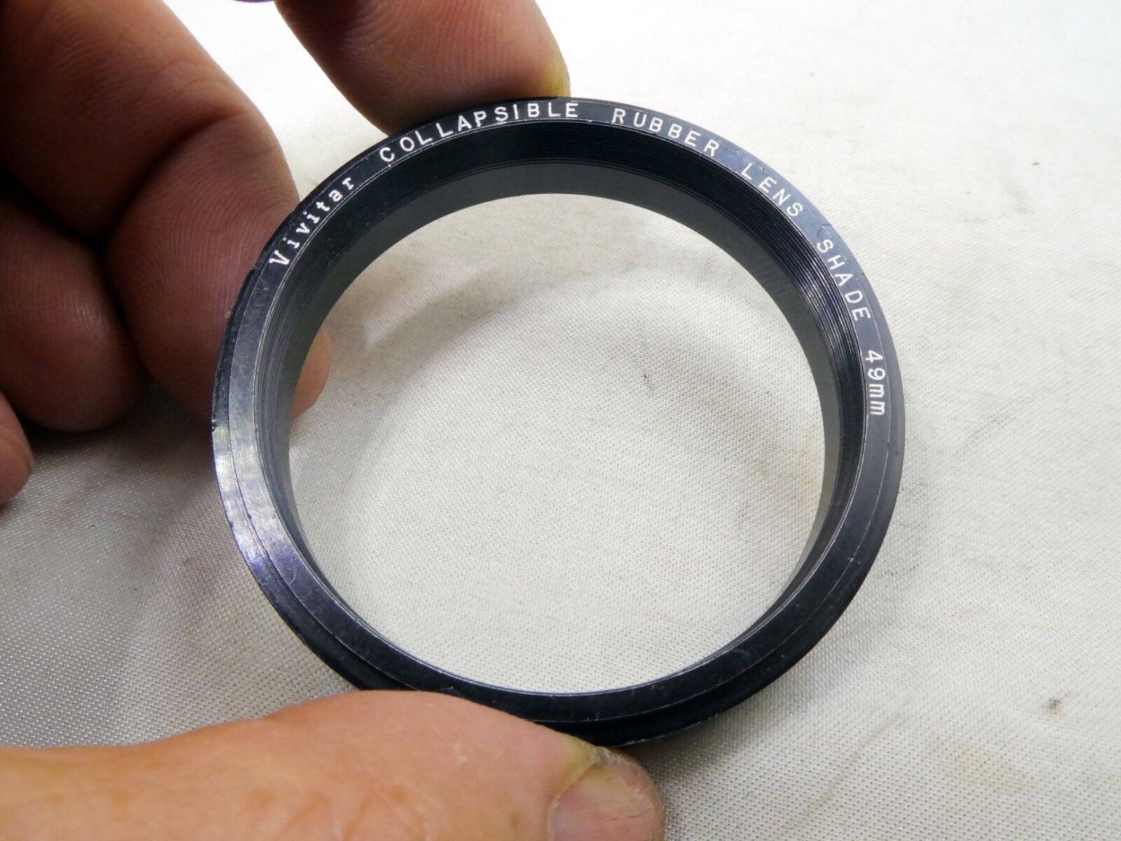 Metal ring from 49mm lens rubber hood (only metal part)