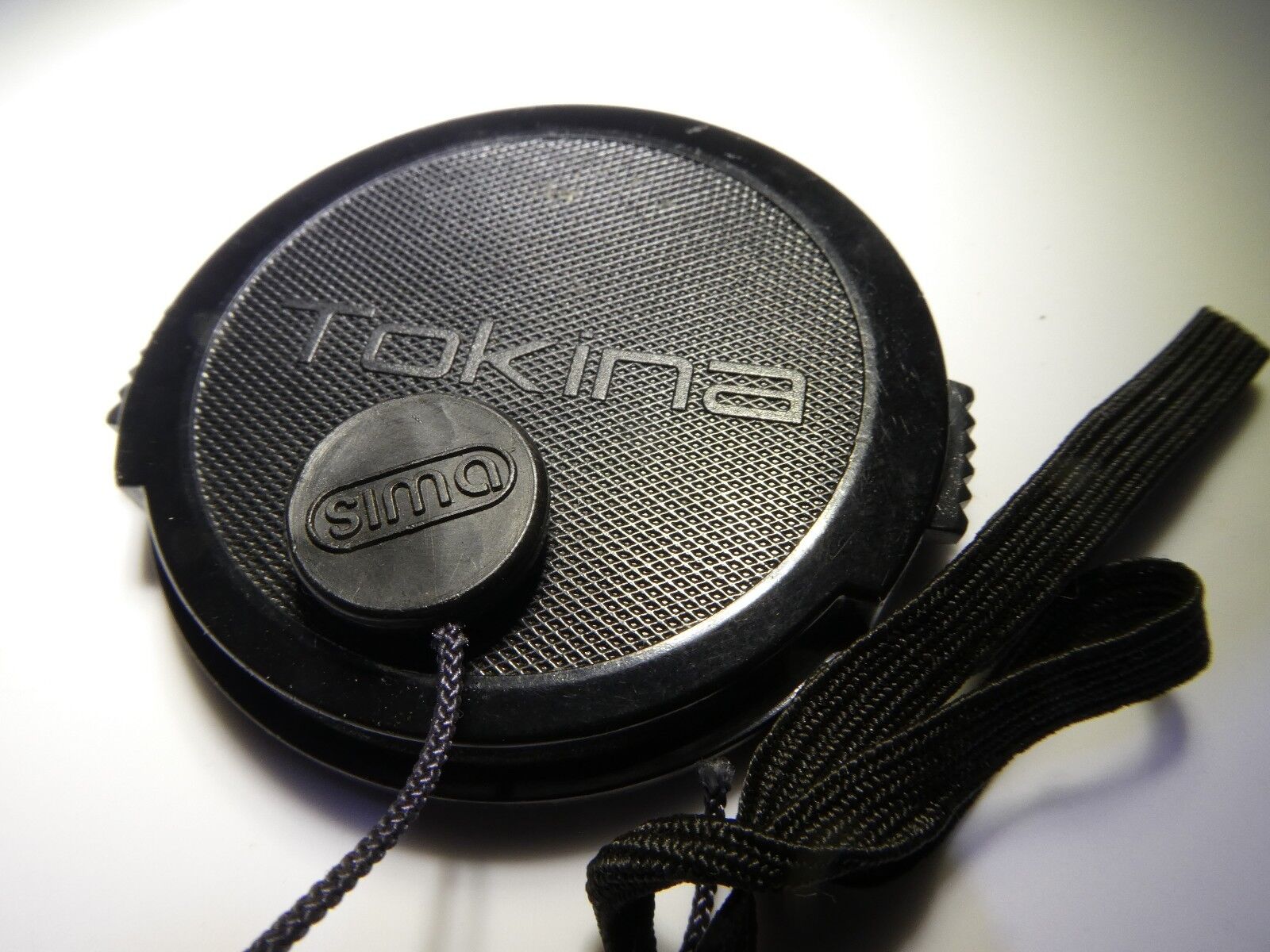 Tokina 55mm RMC II Lens Front Cap with keeper string