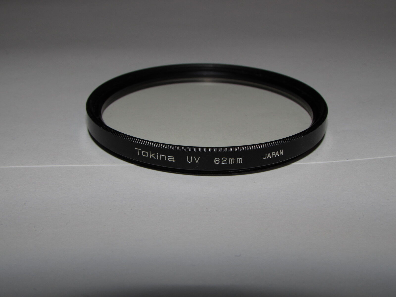 genuine Tokina UV 62mm Lens Filter Made in Japan coating scratched by cleaning