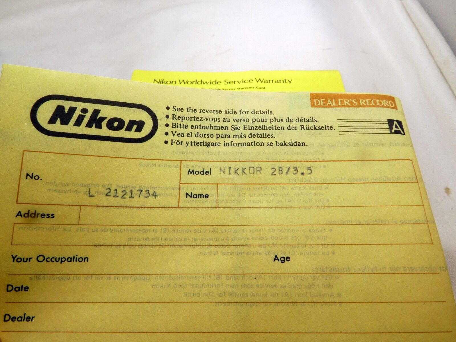 Nikon vintage 28mm f3.5 Ai-s Nikor lens warranty card