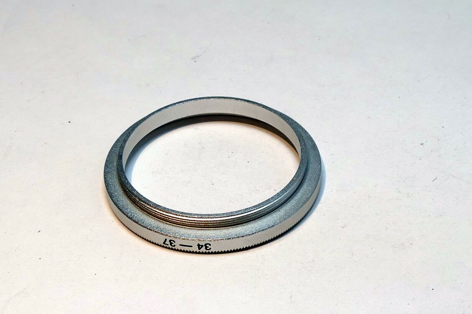 34mm to 37mm Step Up lens ring adapter  screw in threaded (chrome)
