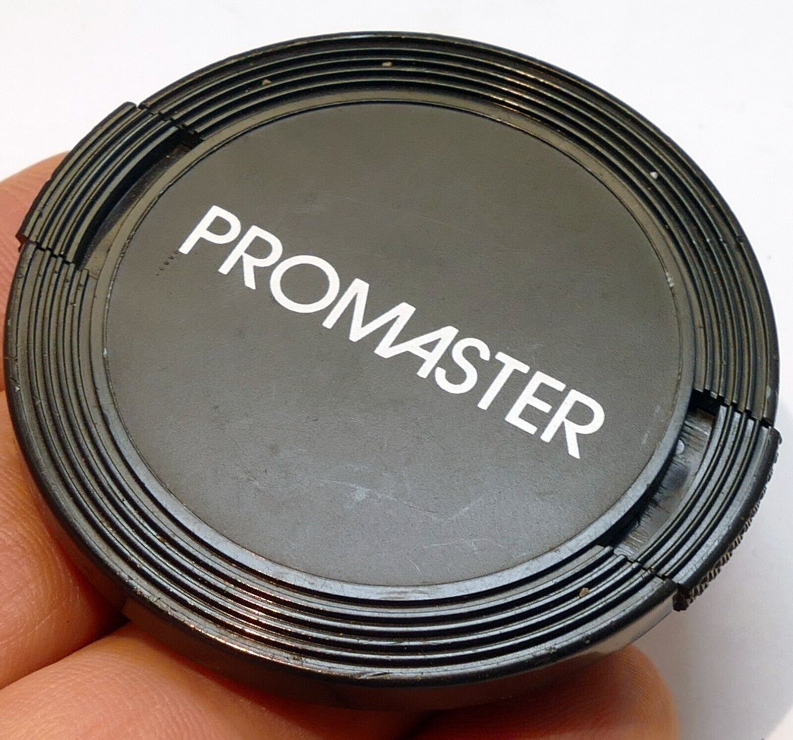 Promaster  52mm front lens cap for 28mm f2.8 50mm macro