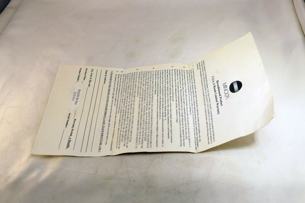 Minolta vintage warranty card (expired) for Reconditioned Maxxum STsi camera