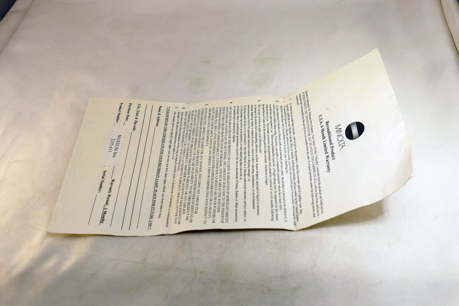 Minolta vintage warranty card (expired) for Reconditioned Maxxum STsi camera