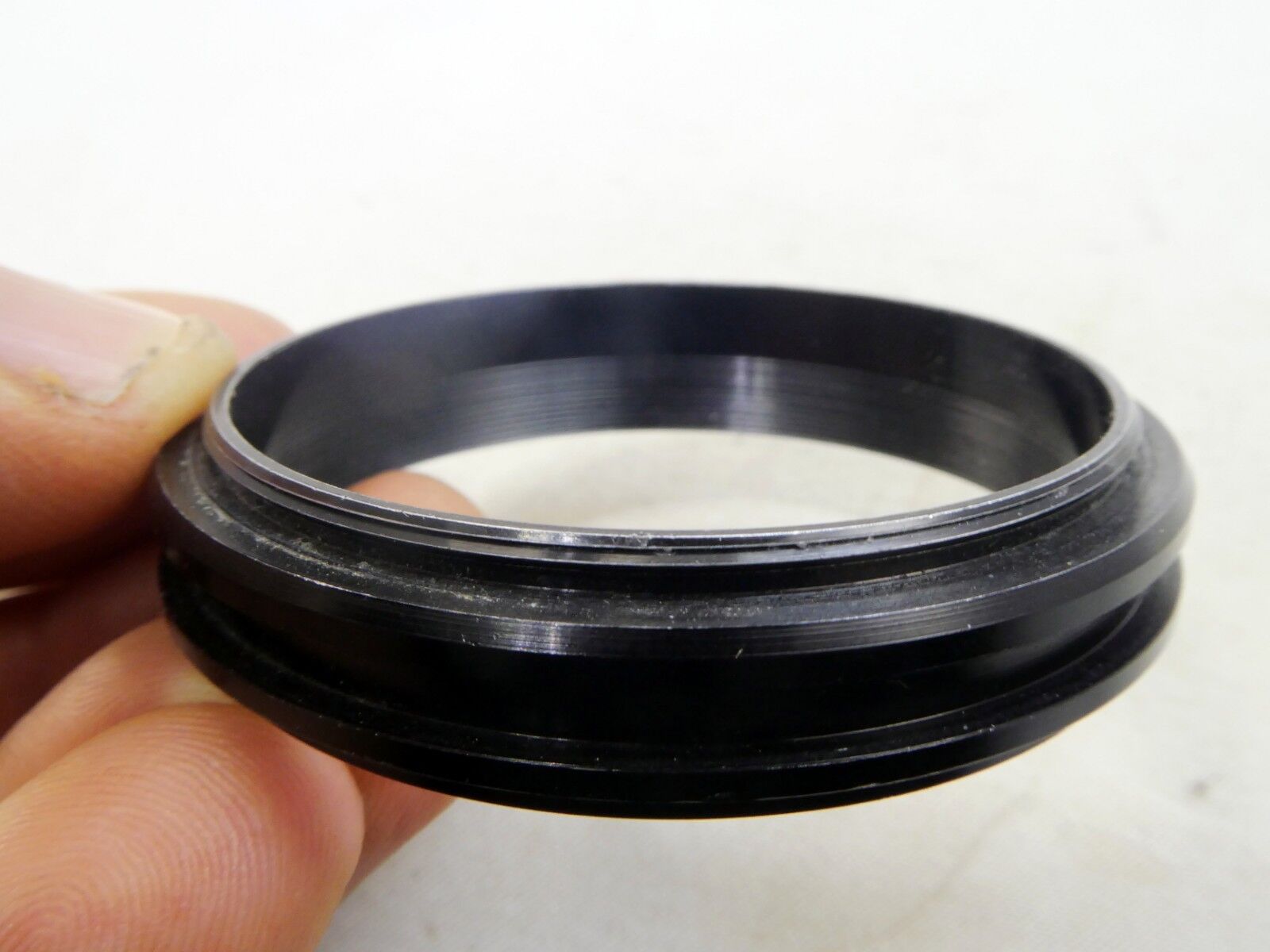 Metal ring from 49mm lens rubber hood (only metal part)