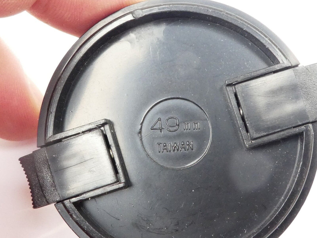 Used 49mm Lens Front Cap Black snap-on type made in Taiwan plastic