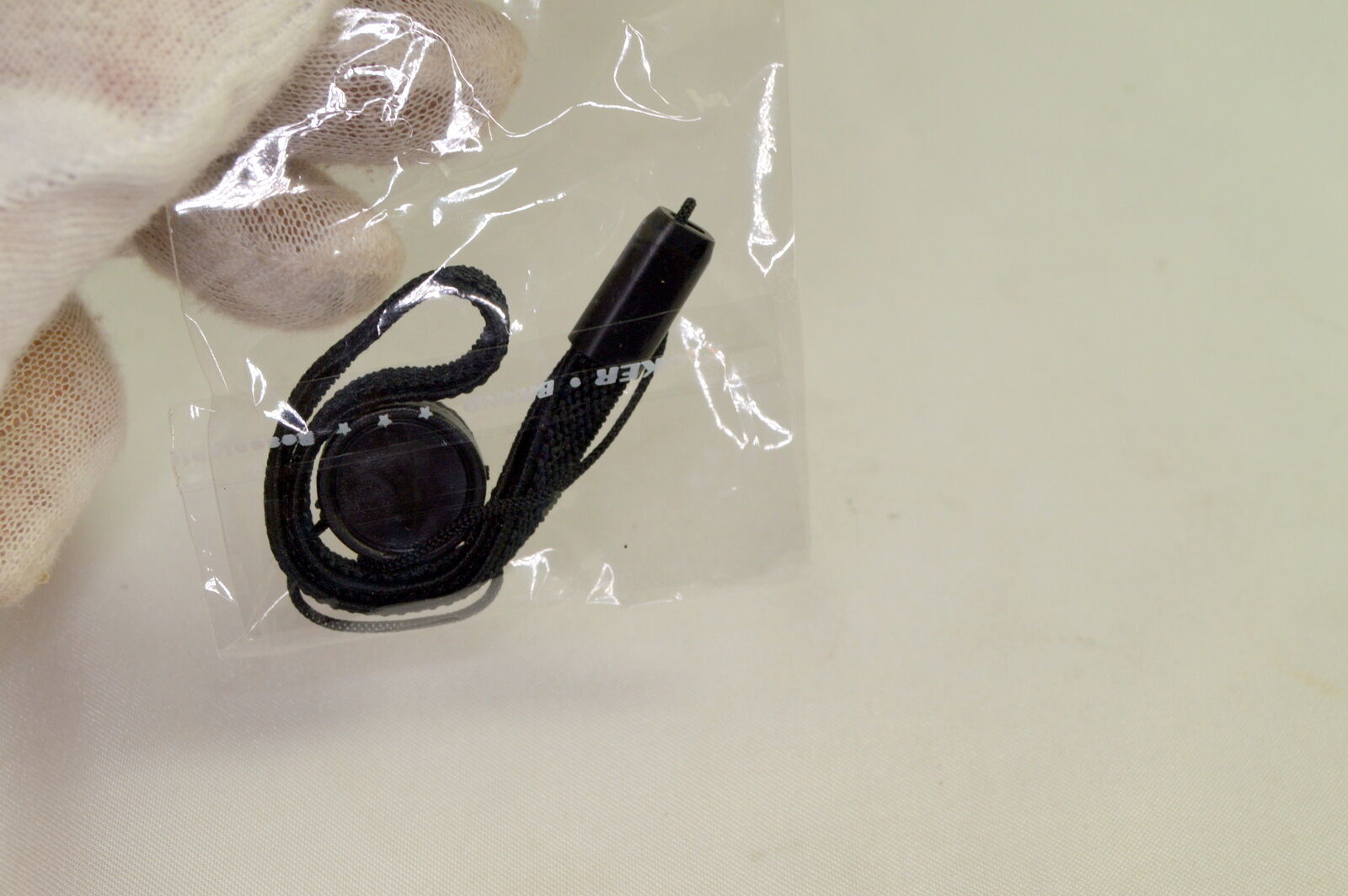 Lens Cap Keeper/ holder stick on type with string