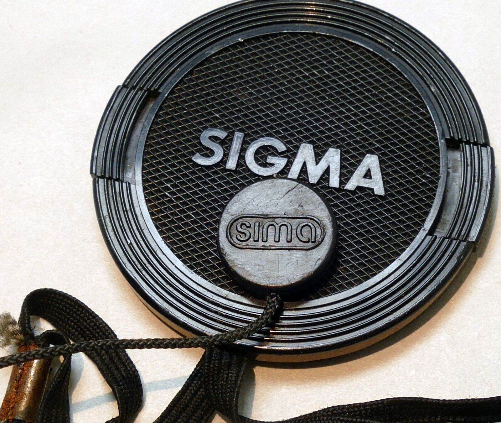 Sigma 52mm lens front cap (snap on type) with keeper string