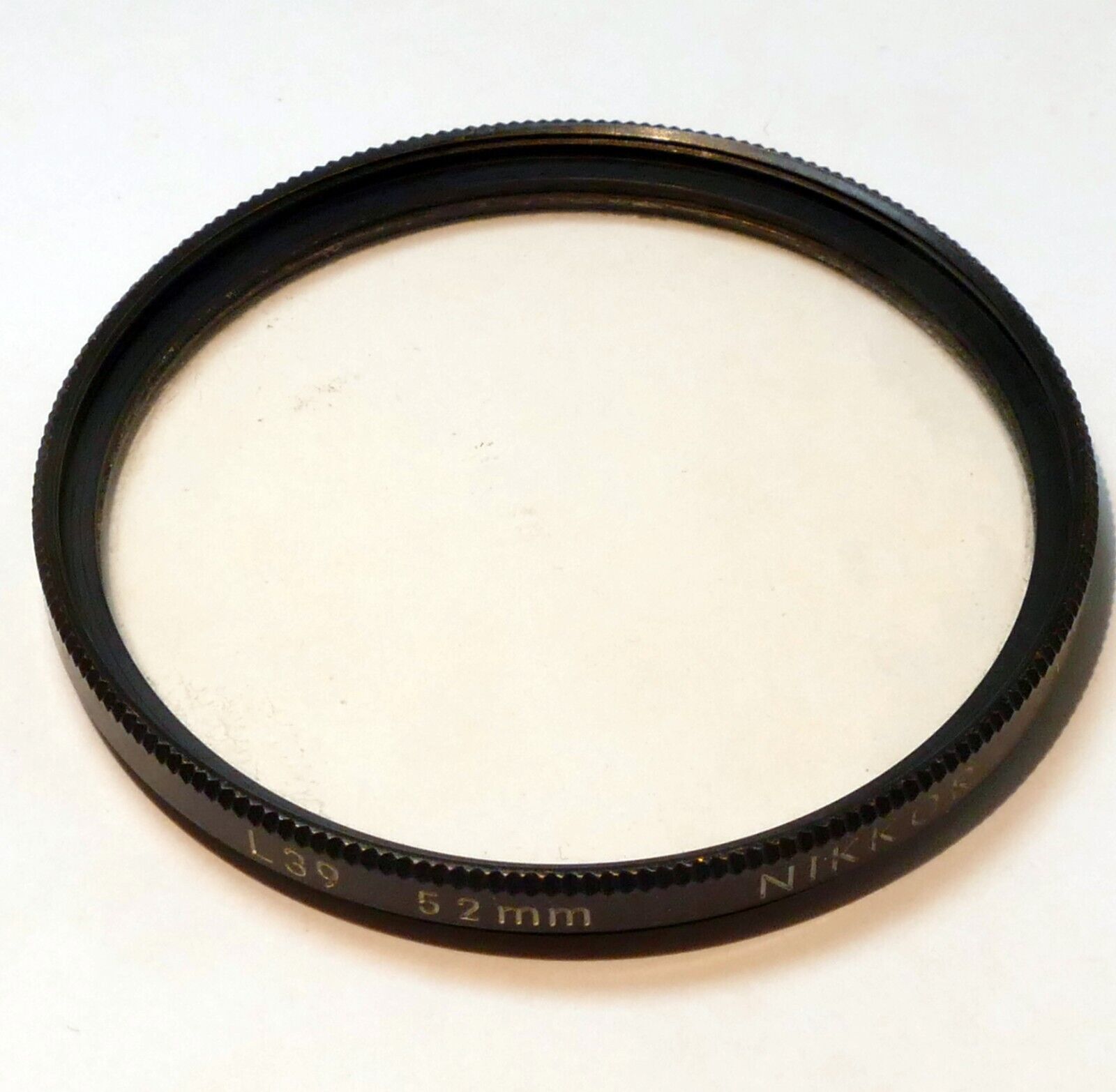 Nikon Nikkor 52mm L39 Filter UV Haze  - genuine , with coating separation