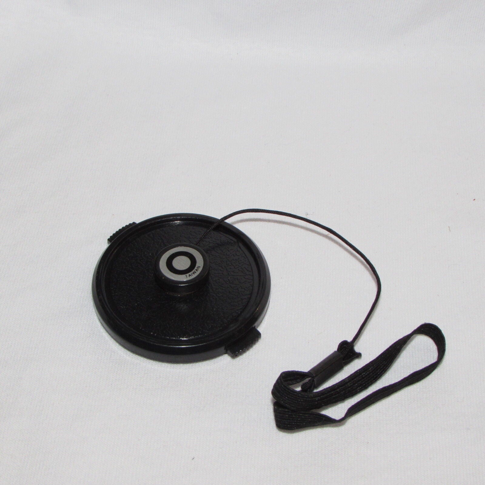 Used 49mm Lens Front Cap Made in Taiwan with string keeper