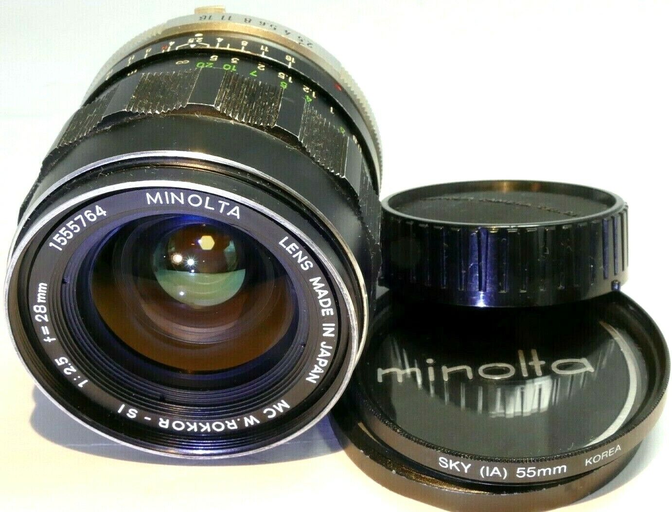 Minolta 28mm f2.5 Lens manual Focus MC W Rokkor- SI ( slow aperture, and dust )