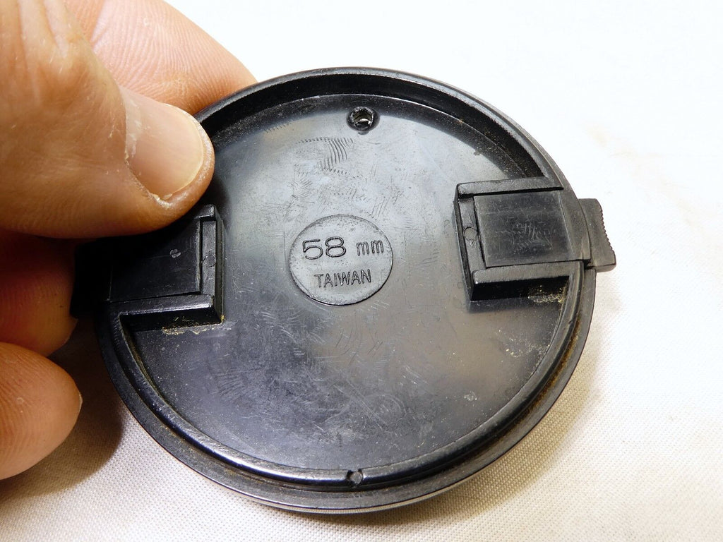 58mm Lens Front Cap made in Taiwan with a hole for the keeper string