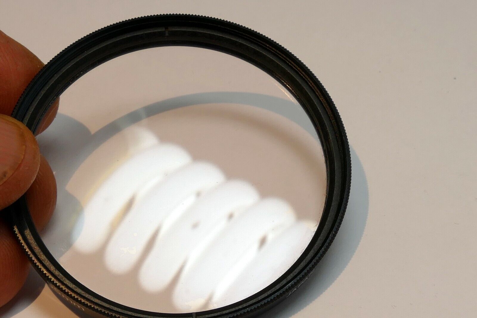 Vivitar  55mm Filter Skylight 1A sky  ( with coating scratched )