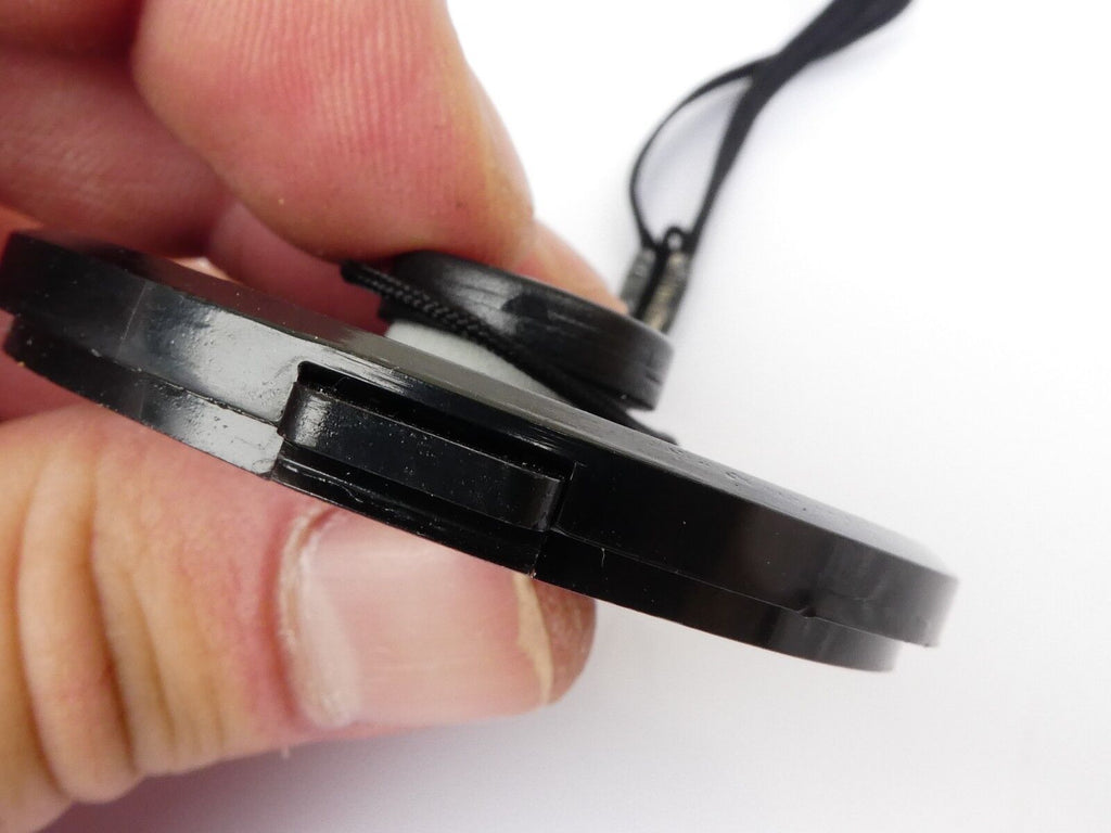 Used 49mm Lens Front Cap Black snap-on type plastic with strap Hong Kong