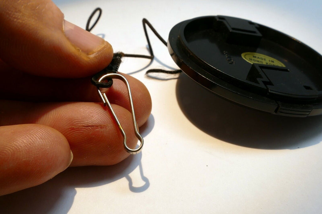 Plastic 55mm Lens front Cap made in Hong Kong with keeper string for f1.7 f1.8