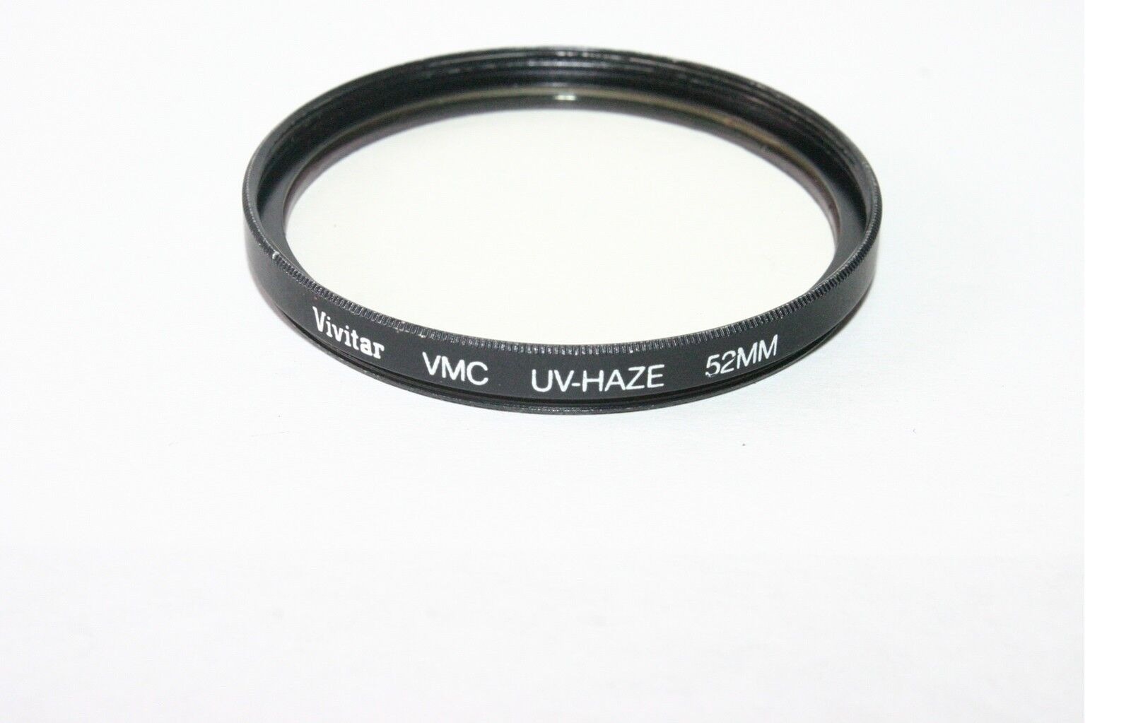 Used Vivitar VMC UV-Haze 52mm Lens Filter with smudges on the coating