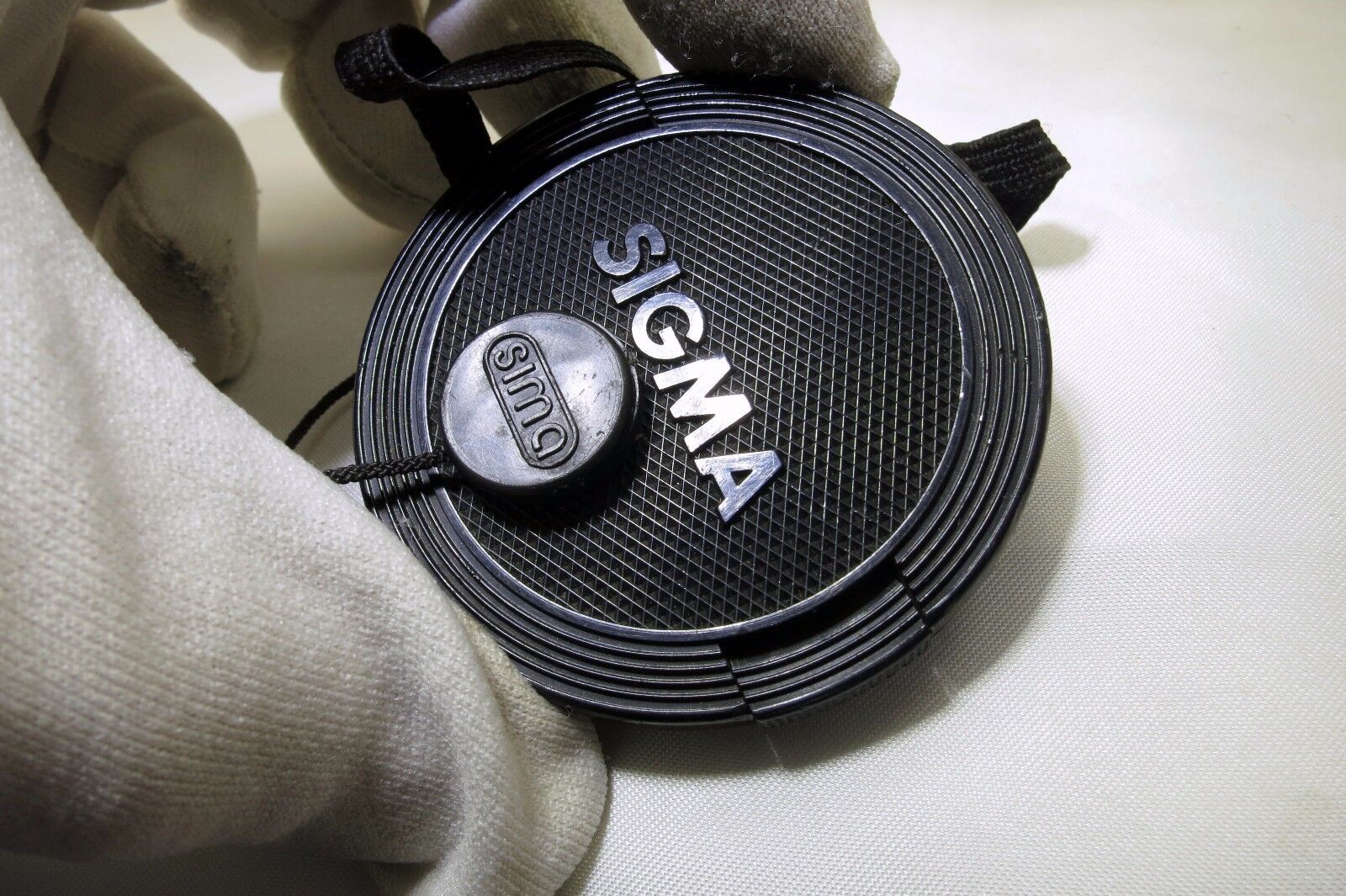 Sigma 55mm Front Cap dust cover with keeper string