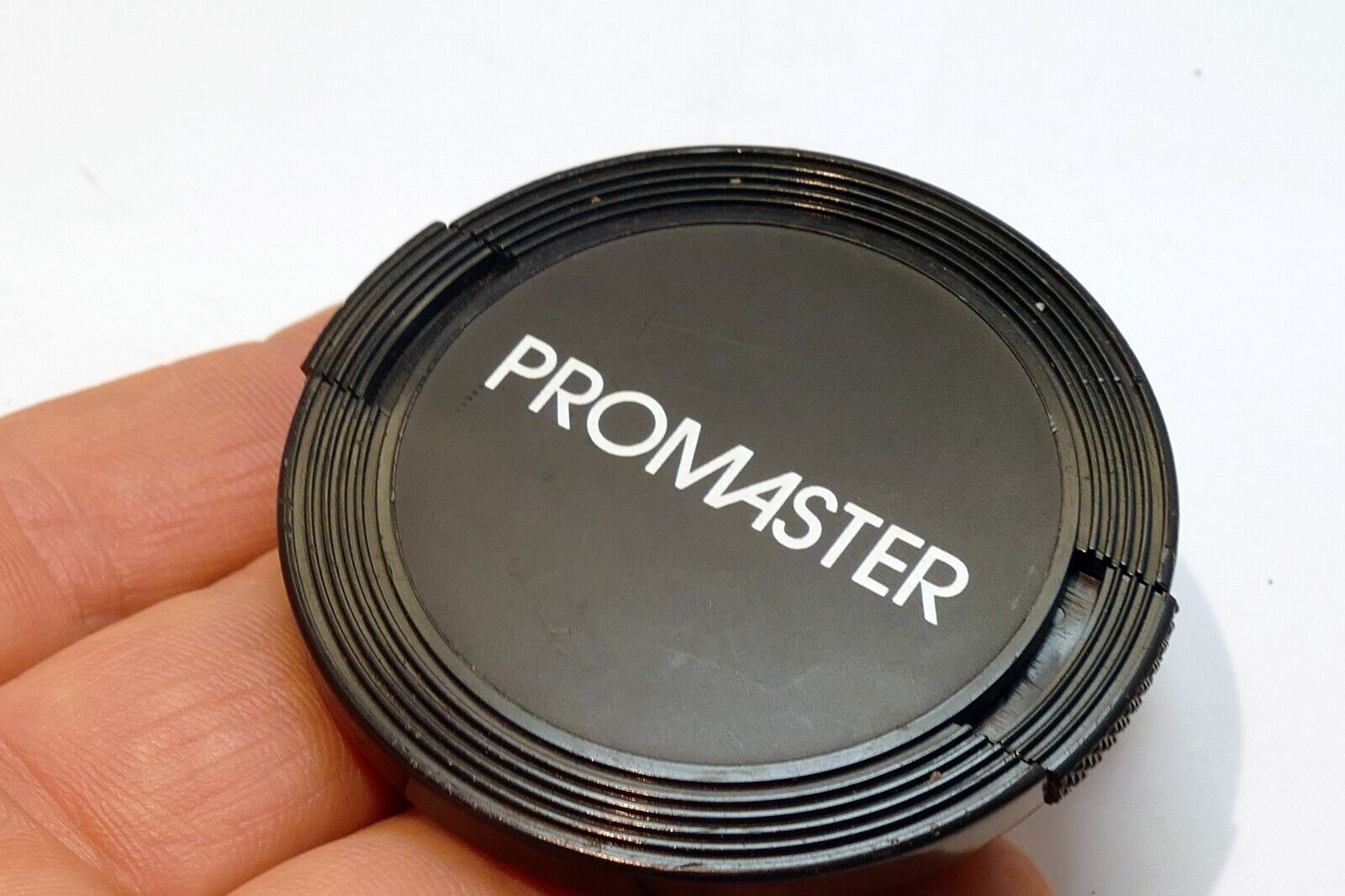 Promaster  52mm front lens cap for 28mm f2.8 50mm macro