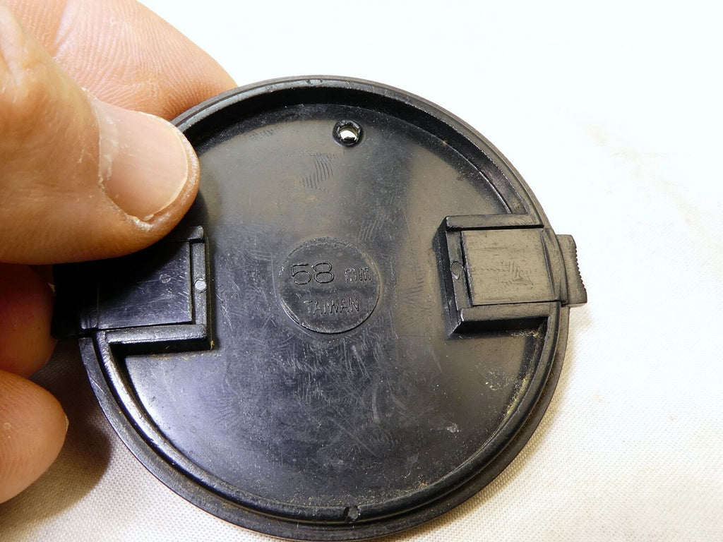 58mm Lens Front Cap made in Taiwan with a hole for the keeper string