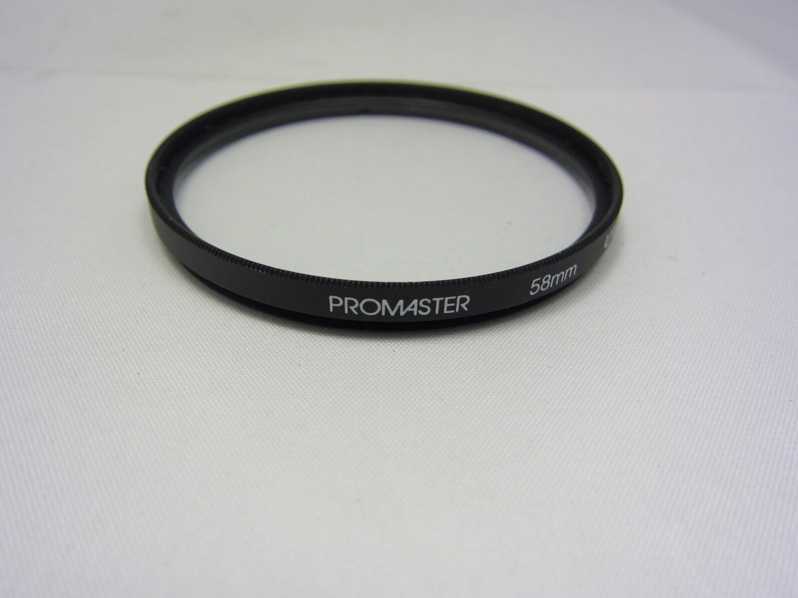 Used PROMASTER 58mm UV Lens Filter Glass Made in PHILIPPINES 6406009