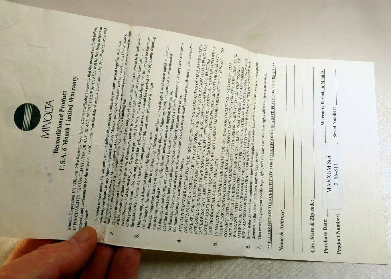 Minolta vintage warranty card (expired) for Reconditioned Maxxum STsi camera
