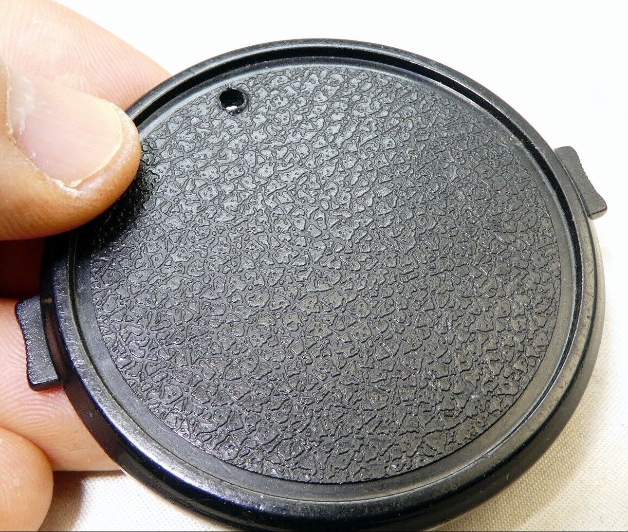 58mm Lens Front Cap made in Taiwan with a hole for the keeper string