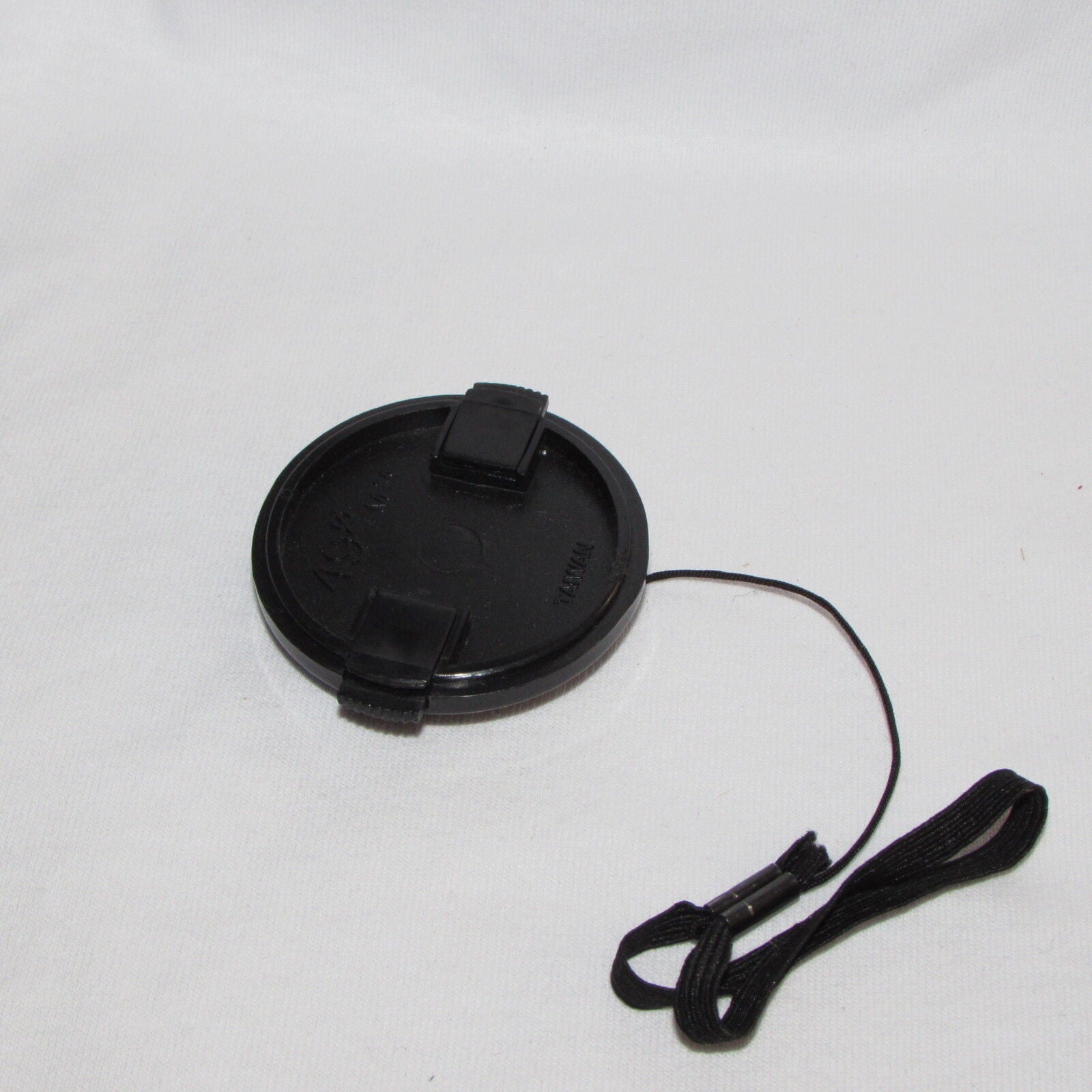 Used 49mm Lens Front Cap Made in Taiwan with string keeper