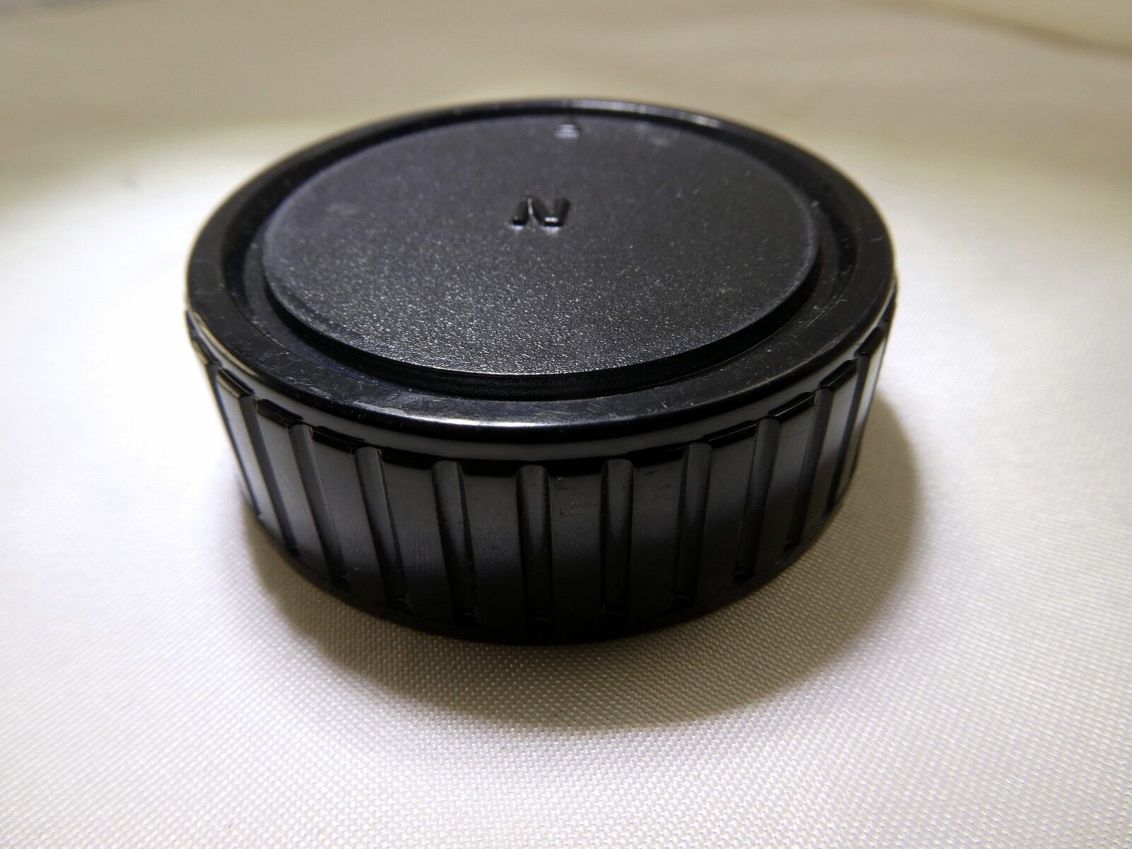 Used "N" Rear Lens Cap for Nikon F lenses 18-55mm  