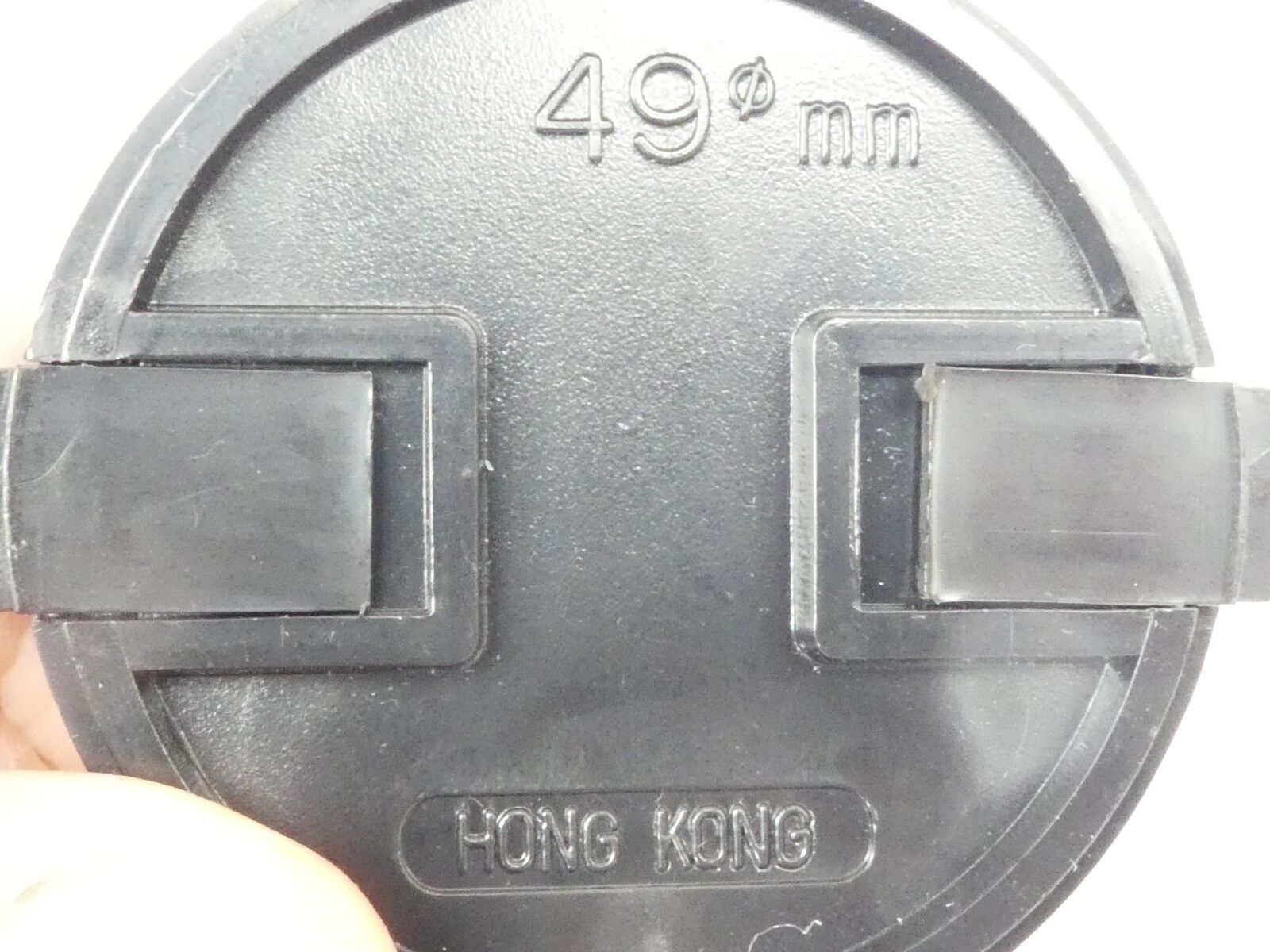 Used 49mm Lens Front Cap Black snap-on type made in Hong Kong plastic