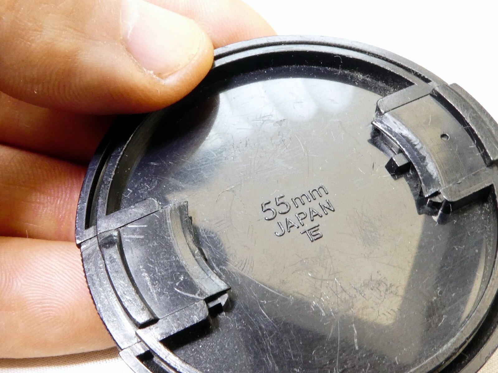 Soligor 55mm Lens front Cap Made in Japan Snap on type      (damaged, but works)